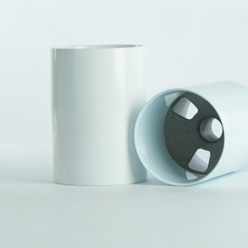 Golf putting greens aluminum golf cups, one standing upright.